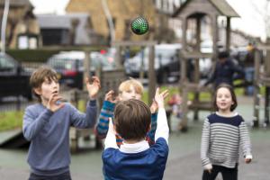 Kids play outside with a throwable computer
